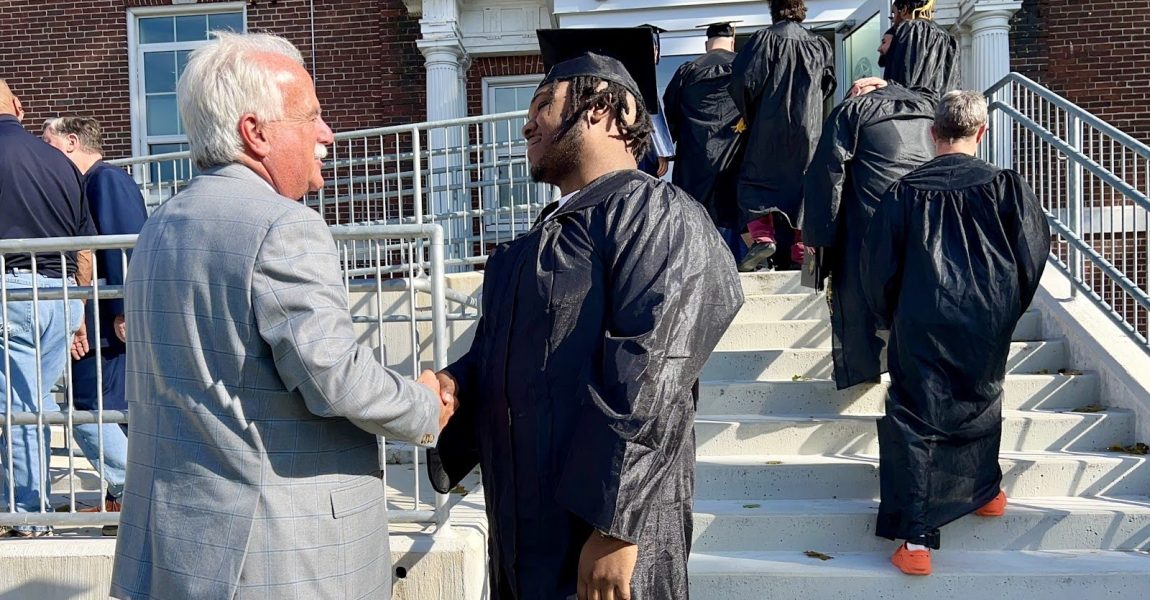 Sheriff shaking hand of graduate